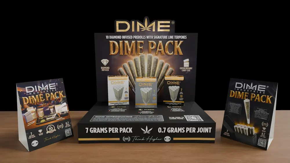 Dime Pack counter display holding three ten-packs, flanked by two Dime Pack table tents, 3D render