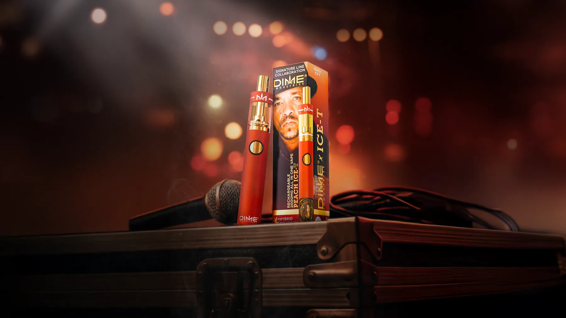 Peach ICE-T device and packaging staged on a road case with a microphone under stage lighting